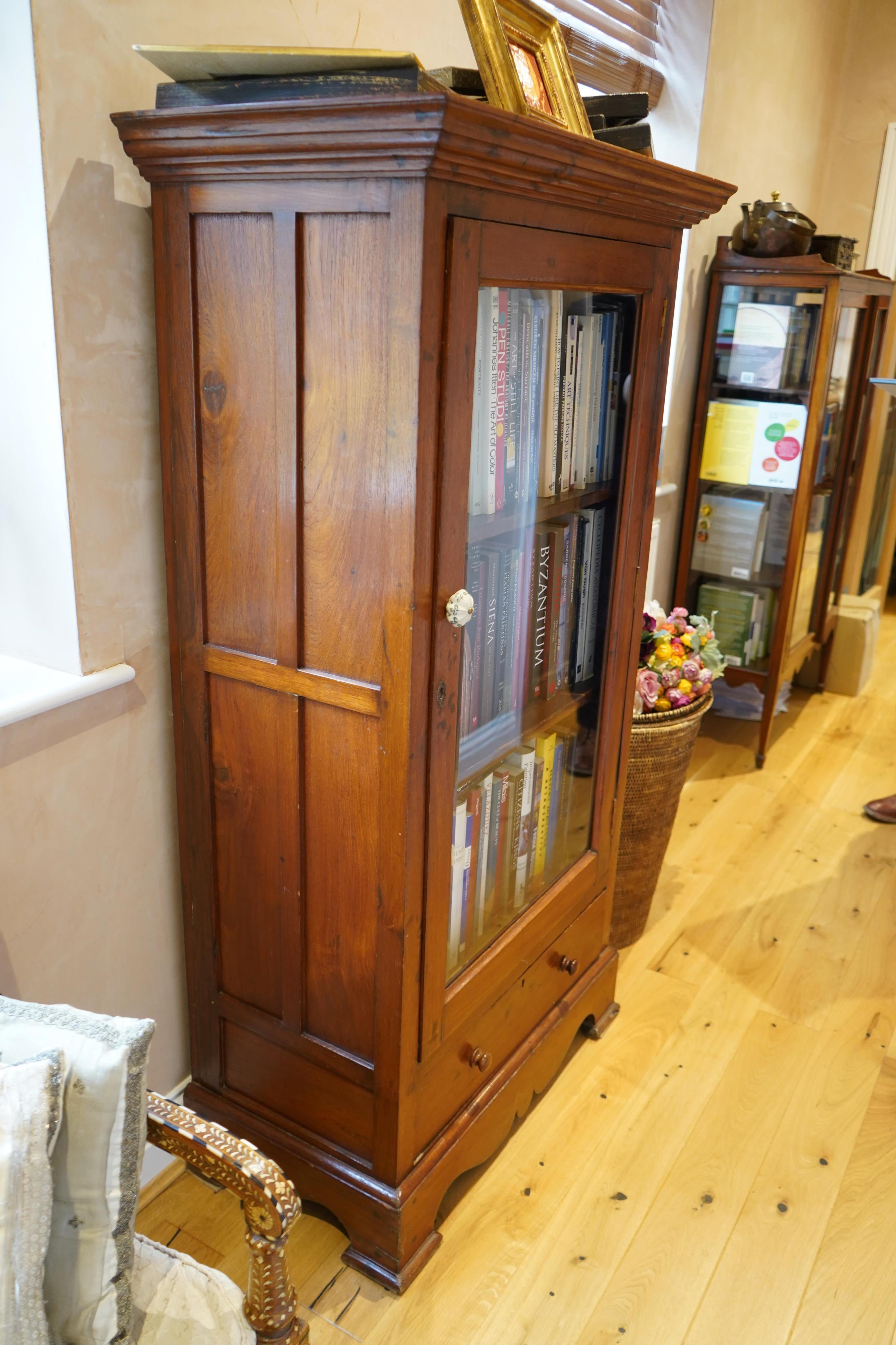 A Louis Philippe style Anglo Indian teak vitrine, with lower drawer, width 89cm, depth 48cm, height 168cm. Condition - fair to good